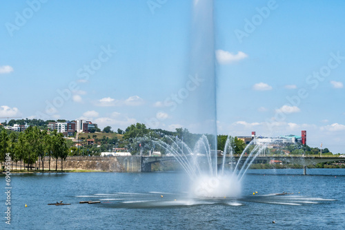 Water fountain on the Mondego River in Coimbra, Portugal. Nature background and wallpaper.