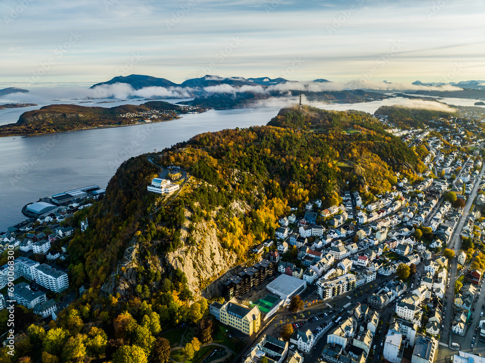 aerial view over hill Aksla Viewpoint, Alesund during sunrise with clouds