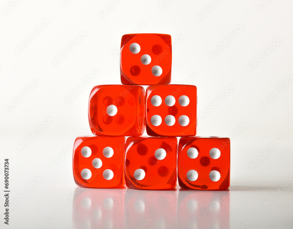 Stack of transparent red gambling dice all numbers front view Stack of transparent red gambling dice all numbers front view