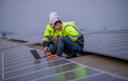 Wallpaper Mural Engineers with walking on factory roof inspect survey and check solar cell panel by notebook and tablet with solar cell is ecology energy alternative power factory concept. Torontodigital.ca