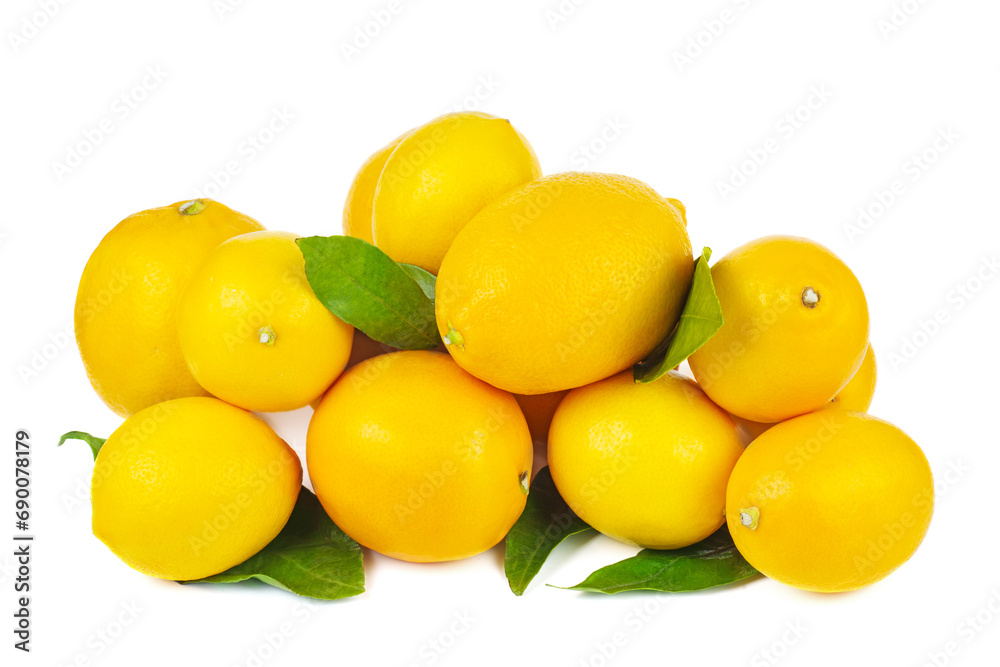 Pile of ripe lemons with green leaves isolated on a white background Pile of ripe lemons with green leaves isolated on a white background