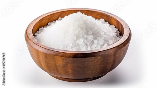 Salt in brown wooden bowl