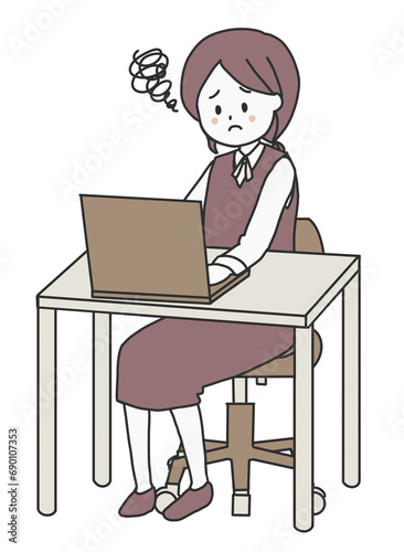 パソコンを操作しながら困っている女性