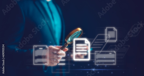 businessman hand holding magnifying glass looking at virtual document icons in concept of DMS and document audit, Auditor Doing Tax Fraud Investigation Using Magnifying Glass