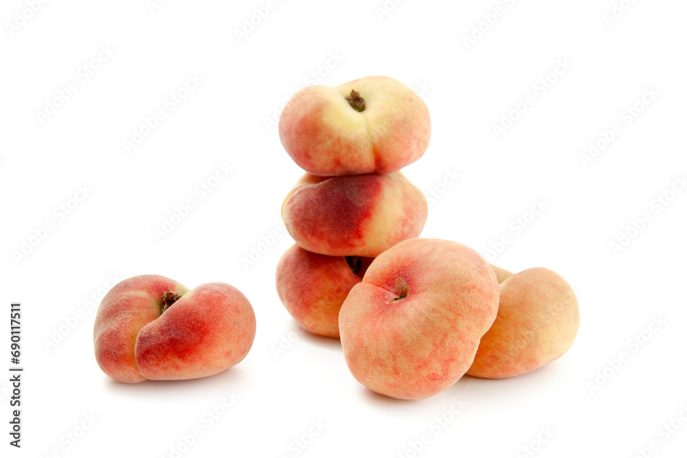Several saturn peaches or flat peaches isolated on white background with clipping path.. Several saturn peaches or flat peaches isolated on white background with clipping path..