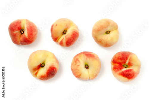 Several saturn peaches or flat peaches isolated on white background with clipping path.. photo