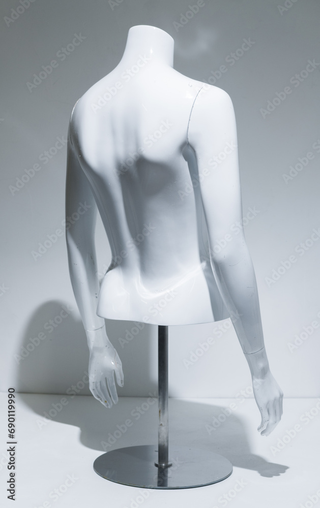 A Female Mannequin Torso With adjustable arms Arms, gloss White Chest . Bust Display on metal pole and base. Fashion model for retail stores to show off clothing. Retail displays. A Female Mannequin Torso With adjustable arms Arms, gloss White Chest . Bust Display on metal pole and base. Fashion model for retail stores to show off clothing. Retail displays.