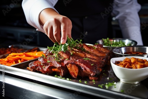 chef garnishing cooked ribs before serving