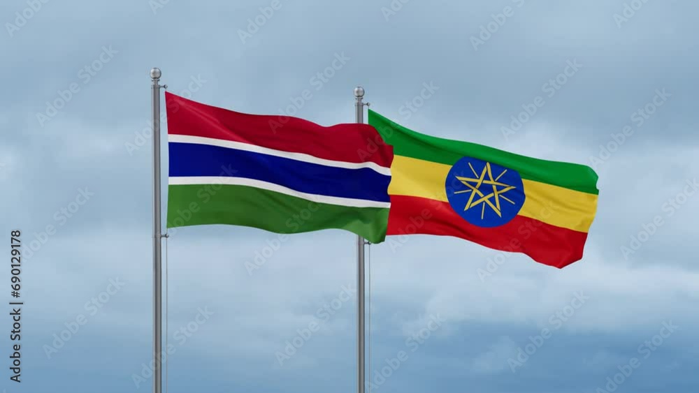 Ethiopia flag and Gambia flag waving together on cloudy sky, endless seamless loop, two country relations concept Ethiopia flag and Gambia flag waving together on cloudy sky, endless seamless loop, two country relations concept