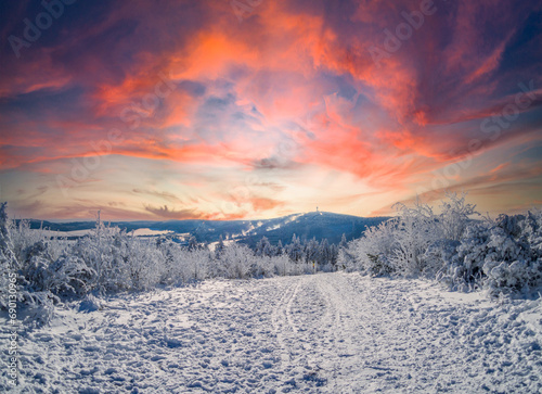 Fantastic winter day in the Erzgebirge with snow and sunset photo