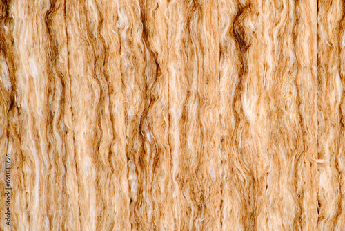 Fotografi Background of yellow glass wool, texture of insulation material close-up