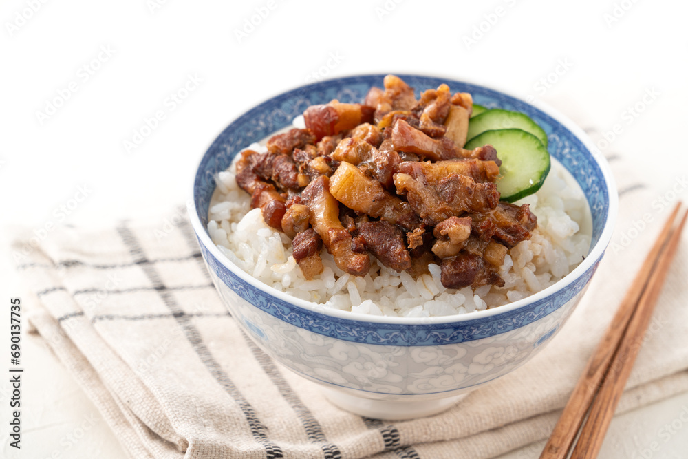 Braised pork belly meat over cooked rice, famous and delicious street food in Taiwanese restaurant. Braised pork belly meat over cooked rice, famous and delicious street food in Taiwanese restaurant.