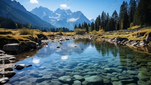 A crystal-clear mountain lake reflecting snow-capped peaks, creating a mirror-like surface that enhances the tranquility of the alpine setting