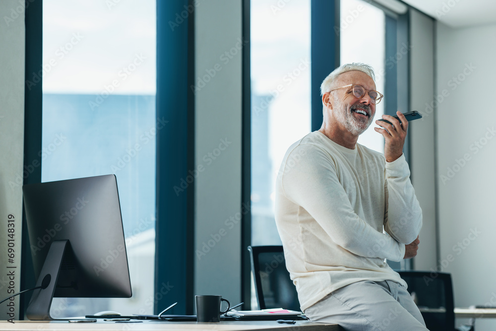 © Jacob Lund - Successful business man speaking on the phone in his office