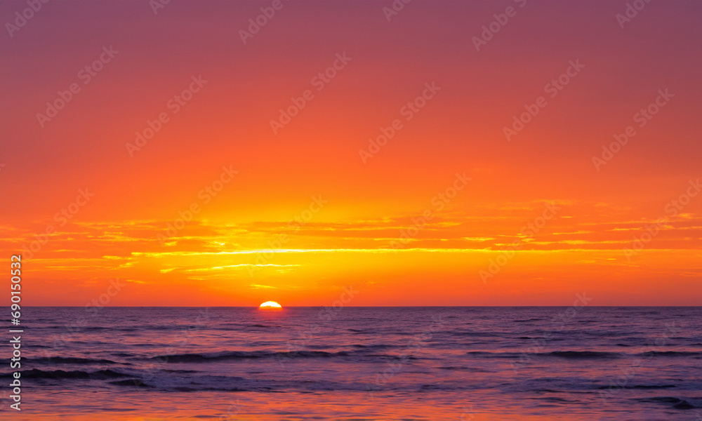 Sunset Over the Sea: Orange Sky Horizon