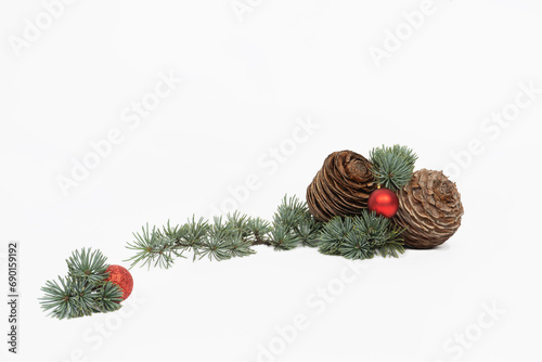 cedar branch with red balls and cones