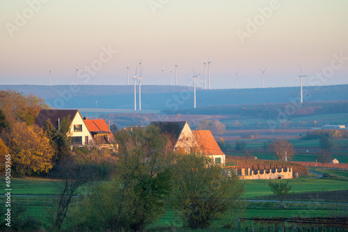 houses in front of windturbines burgenland