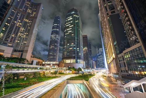 Elevated view of city traffic light trail in Hong Kong financial district.  Skyscraper in downtown district of Hong Kong city at night
