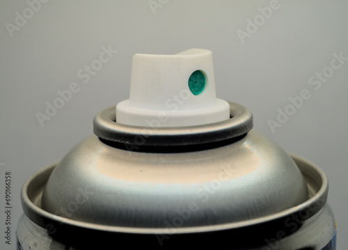 White plastic cap on a metal can close up