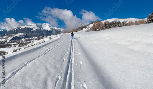 skier hiking in snowy mountain landscape in the French Alps in Tarentaise