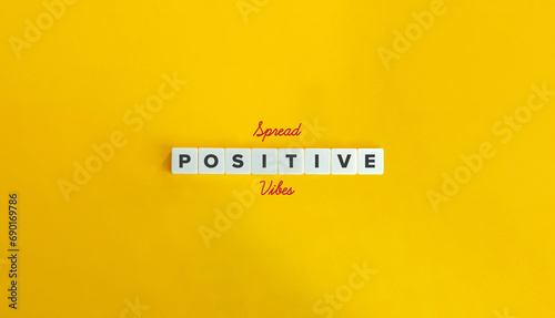 Spread Positive Vibes Message. Share Positivity, Good Energy. Block Letter Tiles and Cursive Text on Yellow Background. Minimalist Aesthetics. photo
