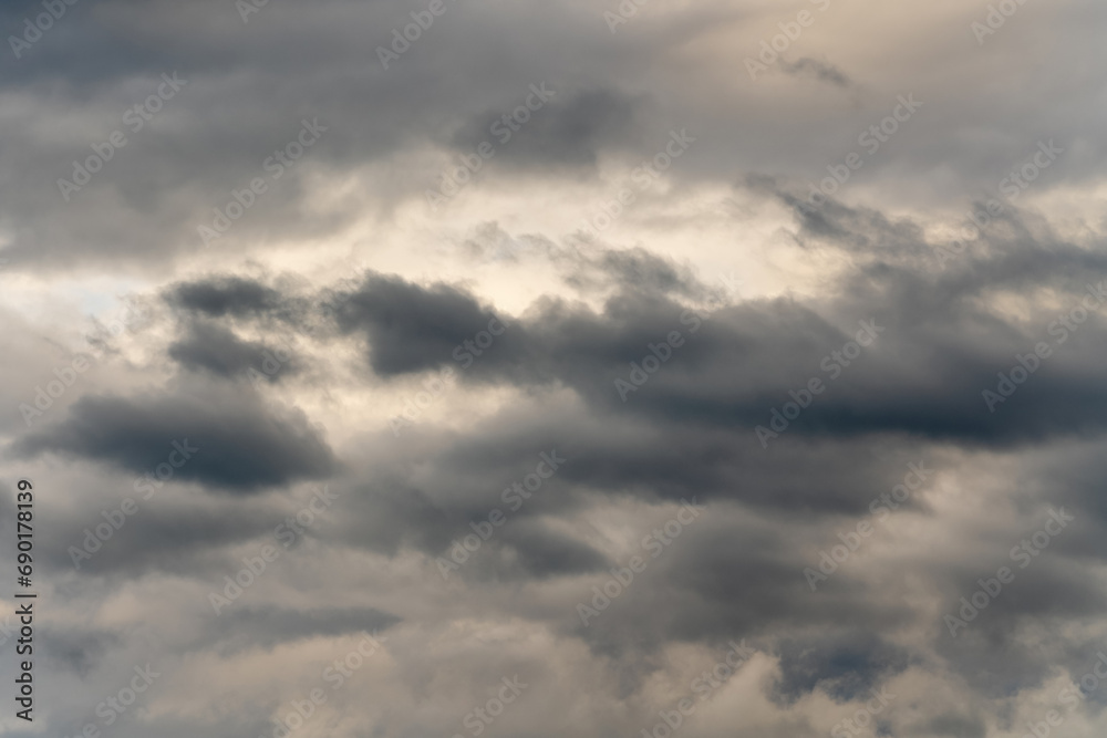 Dramatic thunderstorm clouds in dusk sky during rain. Amazing view of natural cloudiness weather background. Soft focus, motion blur cloudscape background