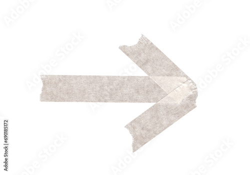torn piece of adhesive masking tape in the shape of a directional arrow on transparent background