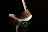 Cosmetics brush and colorful makeup powder