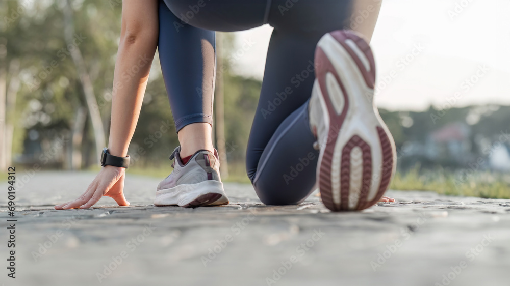 Close-up photo of women is sports shoes Get ready for a run on a bright spring day. - obrazy, fototapety, plakaty 