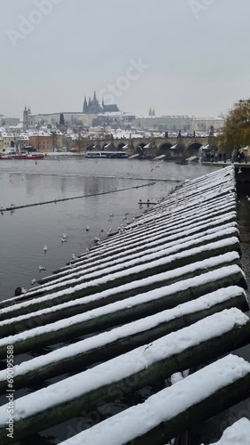 landscape in winter in Prague, Czech Republic with Vltava river and Charles Bridge . photo