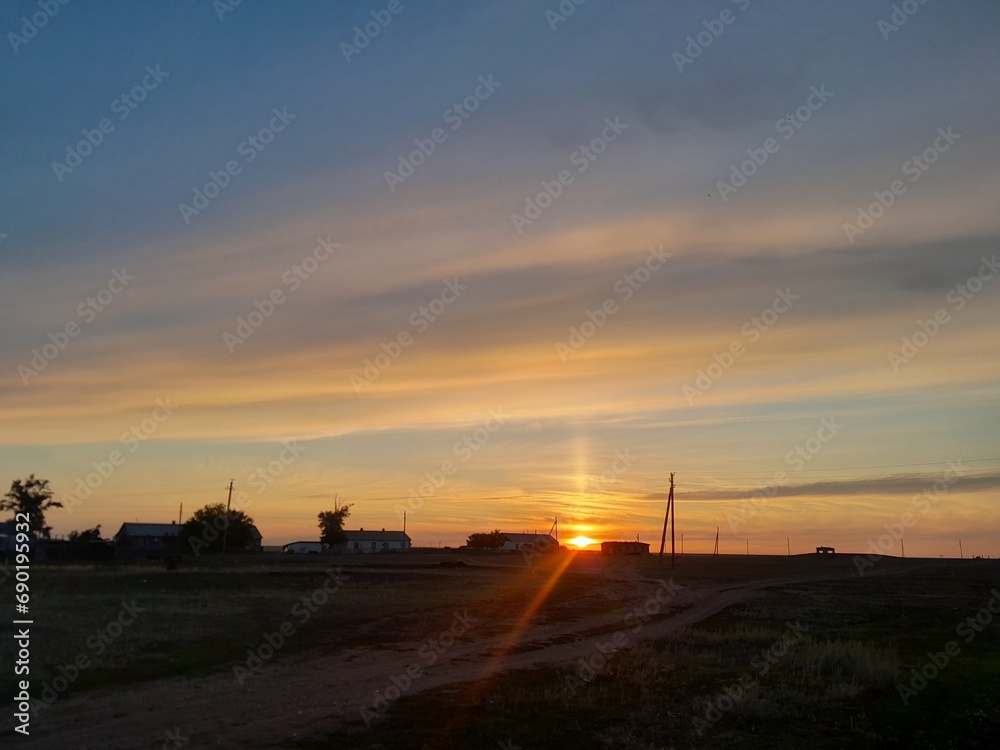 Beautiful sunset - view of an village . High quality photo. Beautiful nature, sky. High quality photo