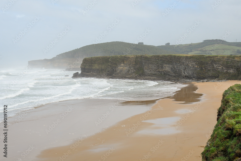 Strong waves breaking on the cliffs of Galizano in Cantabria