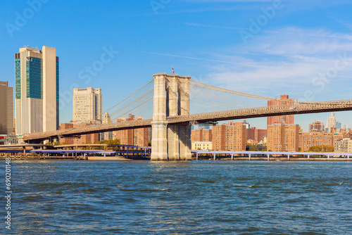 Beautiful view Brooklyn Bridge, Lower Manhattan skyscraper across East River at New York