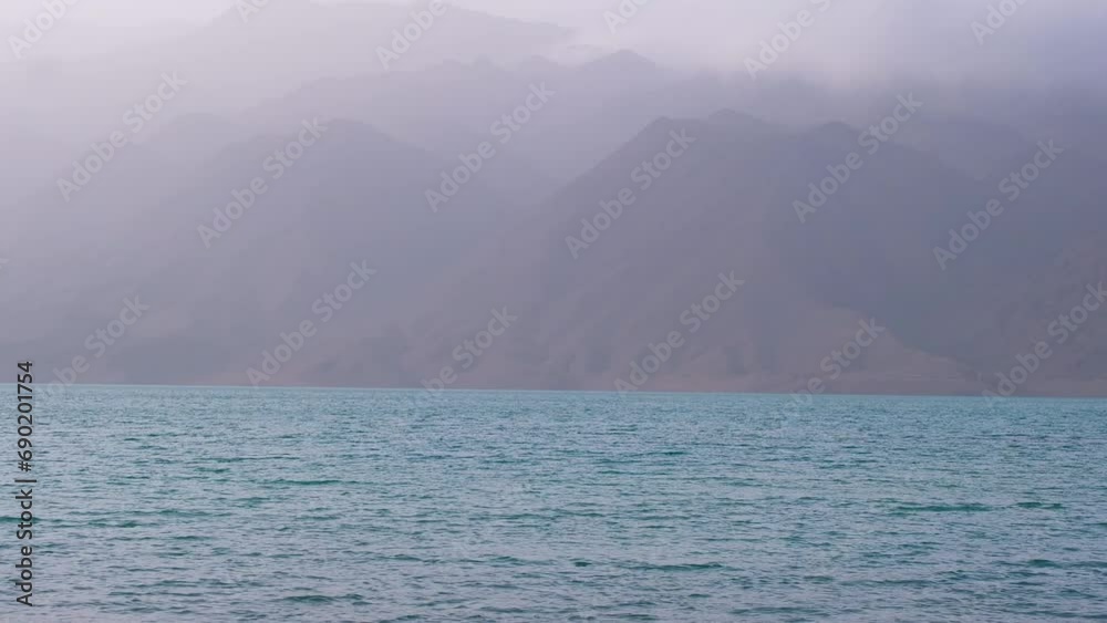 Bartogay reservoir on the Chilik river surrounded by the Tien Shan mountains in the Almaty region. Lake with blue water near the mountains Bartogay reservoir on the Chilik river surrounded by the Tien Shan mountains in the Almaty region. Lake with blue water near the mountains