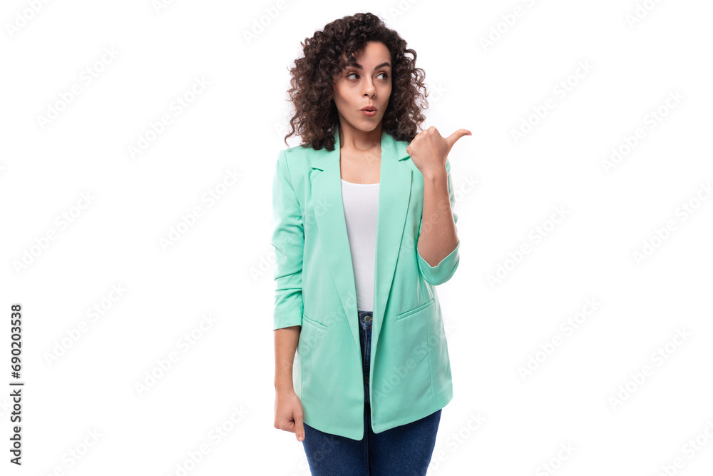 pretty young brunette curly businesswoman dressed in a blue jacket tells interesting news pretty young brunette curly businesswoman dressed in a blue jacket tells interesting news