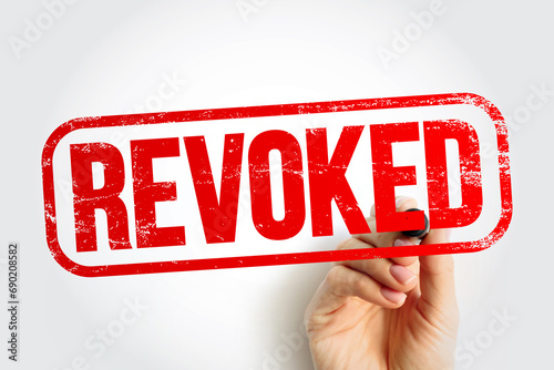 REVOKED text stamp, business concept background photo