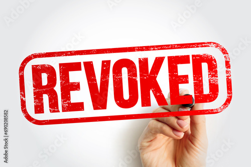 REVOKED text stamp, business concept background