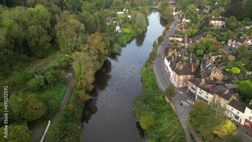 Drone shot of the buildings of Ironbridge village on the banks of River Severn with the Iron Bridge photo