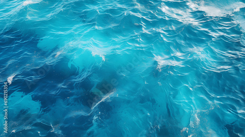 Top view of turquoise sea surface with ripples and waves