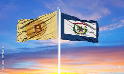 Bitcoin and West Virginia two flags on flagpoles and blue sky.