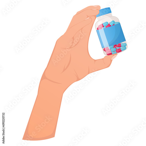 Hand holding a bottle with medical capsules isolated on white
