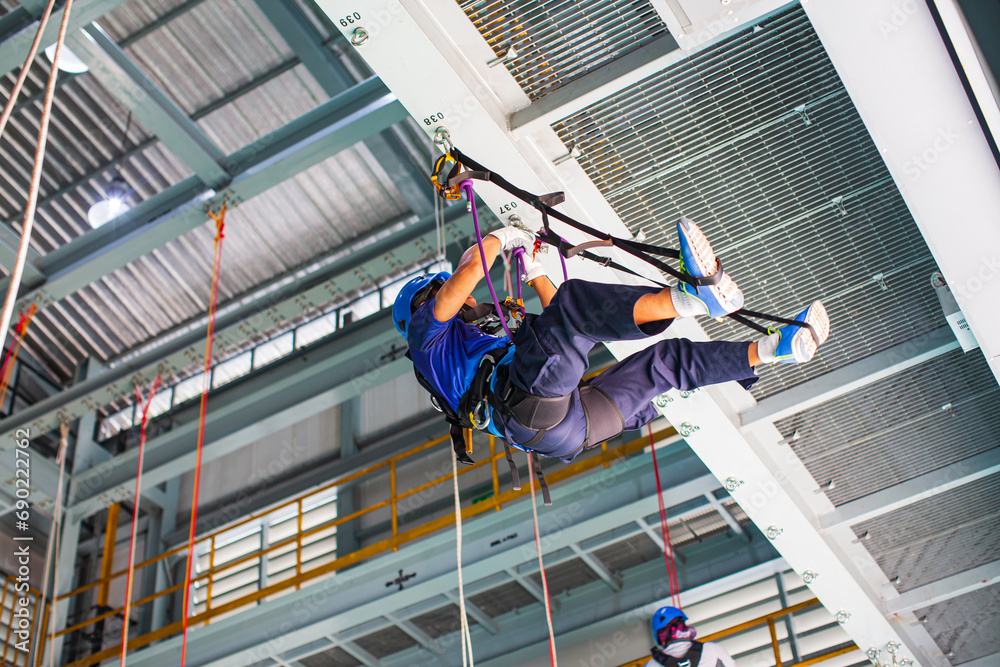 Male worker training rope access