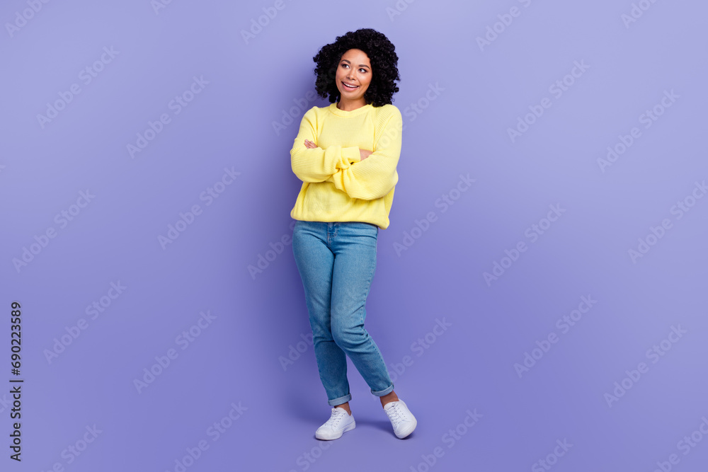 Full length photo of optimistic person wear knit pullover hold hands folded look at sale empty space isolated on purple color background Full length photo of optimistic person wear knit pullover hold hands folded look at sale empty space isolated on purple color background