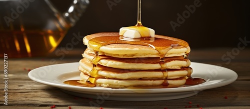 Fluffy buttermilk pancakes with butter and maple syrup. Website header. Creative Banner. Copyspace image photo
