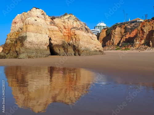 Epic Algarve beach in Portimao with typical red cliffs