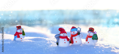 cute snowman friends on snowy landscape. Winter nature background. Christmas and new year holidays concept. festive winter season. banner. copy space
