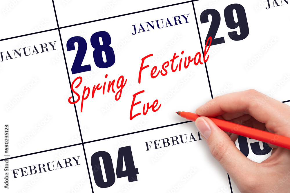January 28. Hand writing text Spring Festival Eve on calendar date. Save the date. Holiday. Day of the year concept. January 28. Hand writing text Spring Festival Eve on calendar date. Save the date. Holiday. Day of the year concept.