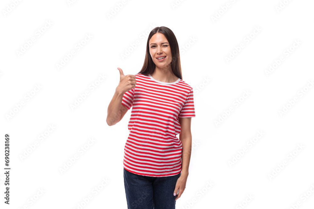 a pretty young caucasian woman with dark straight hair in glasses and in a striped red t-shirt gestures with her hands on a white background a pretty young caucasian woman with dark straight hair in glasses and in a striped red t-shirt gestures with her hands on a white background