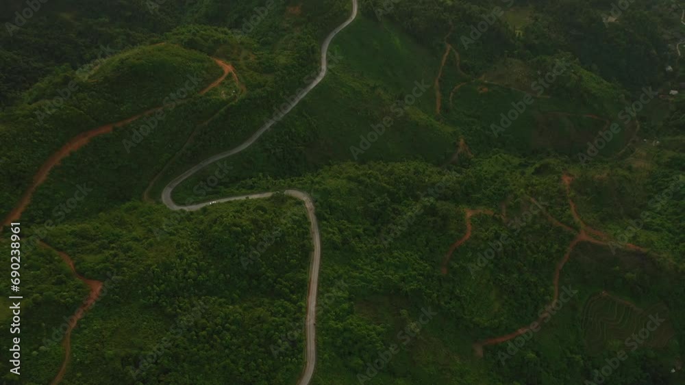 Mountains, forest and drone with hills, road and landscape scenery. Outdoor, nature and trees with view, peaceful and environment for sustainability, greenery or country with foggy grey skies Mountains, forest and drone with hills, road and landscape scenery. Outdoor, nature and trees with view, peaceful and environment for sustainability, greenery or country with foggy grey skies