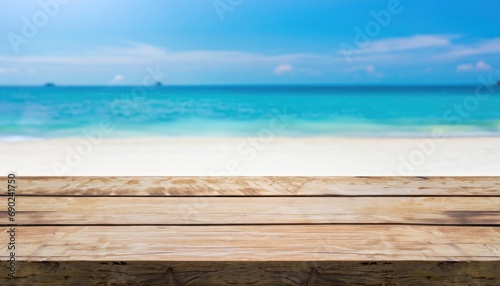 Fototapeta Naklejka Na Ścianę i Meble -  The wood table top on blurred blue sea and white sand beach background